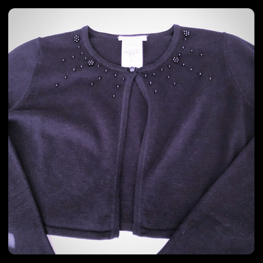 Girl’s black cardigan sweater